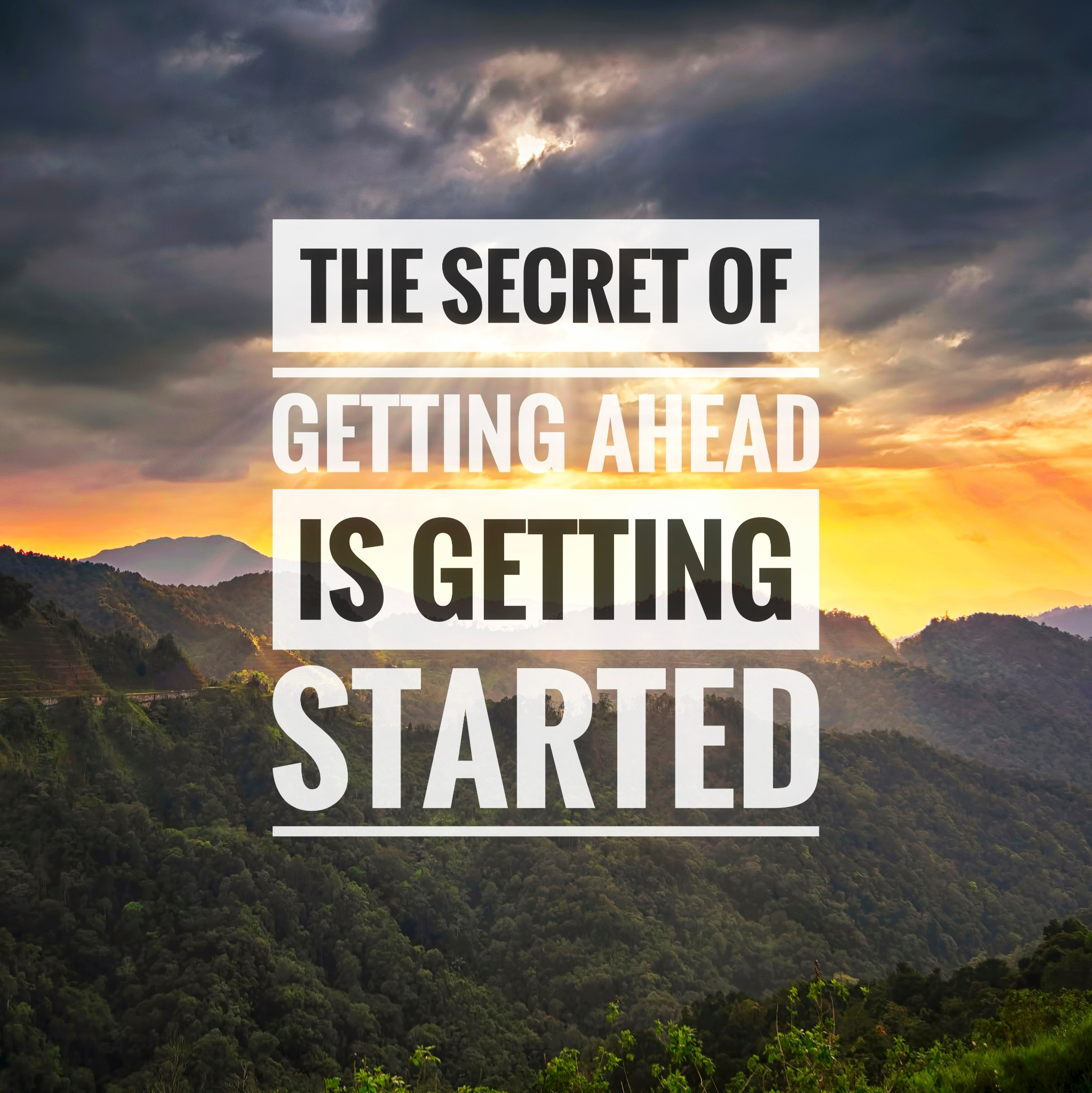 image of the mountains and the words "The secret of getting ahead is getting started"