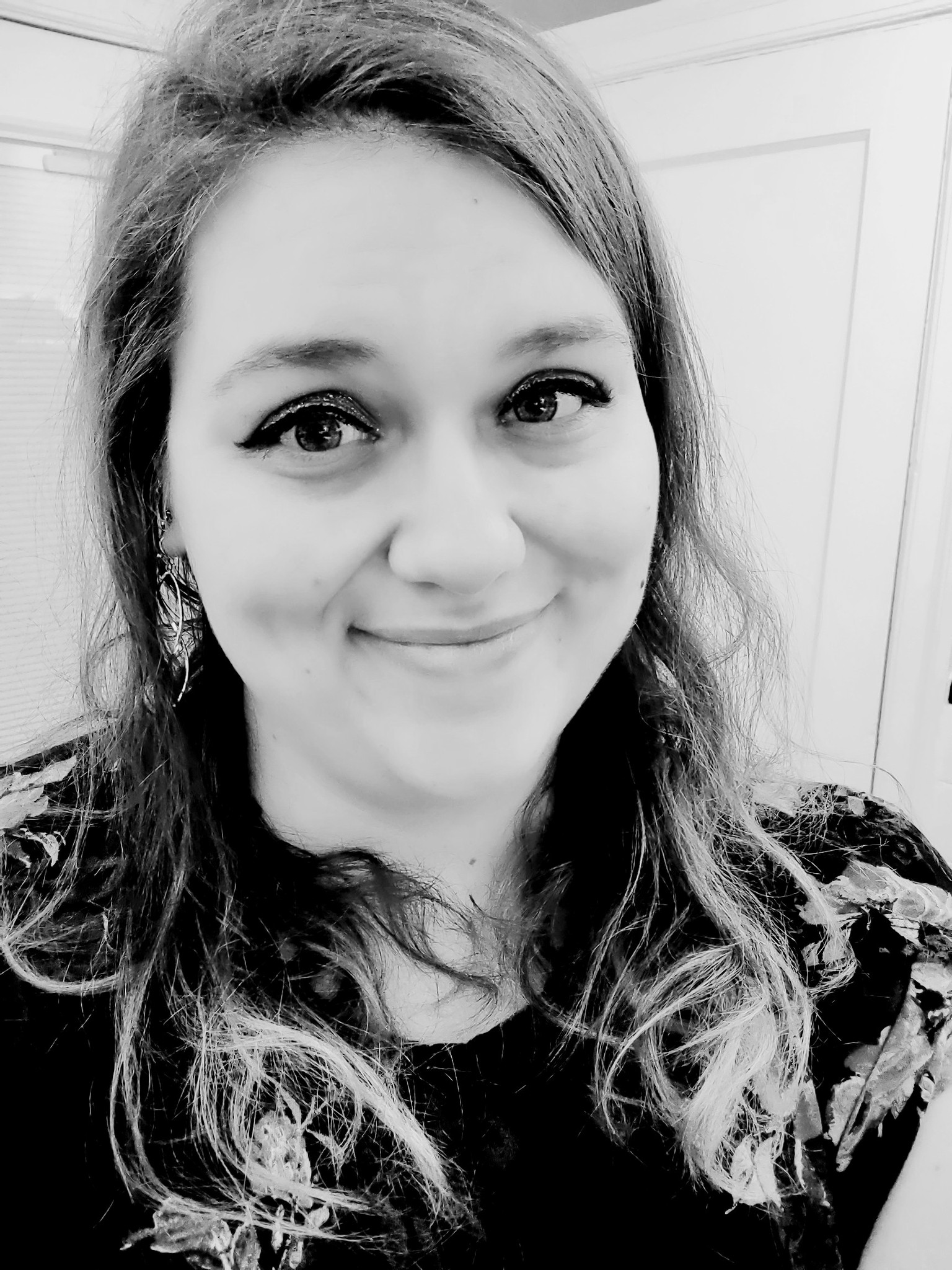 Owner of Word Alchemy LLC, Tiffany Anne Crowder, in black and white headshot image